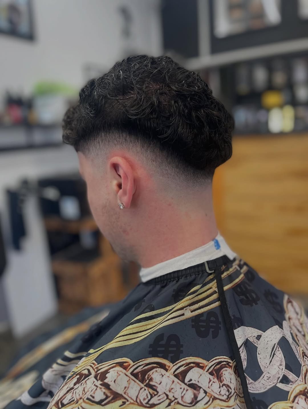 Side part fade with shaved design line