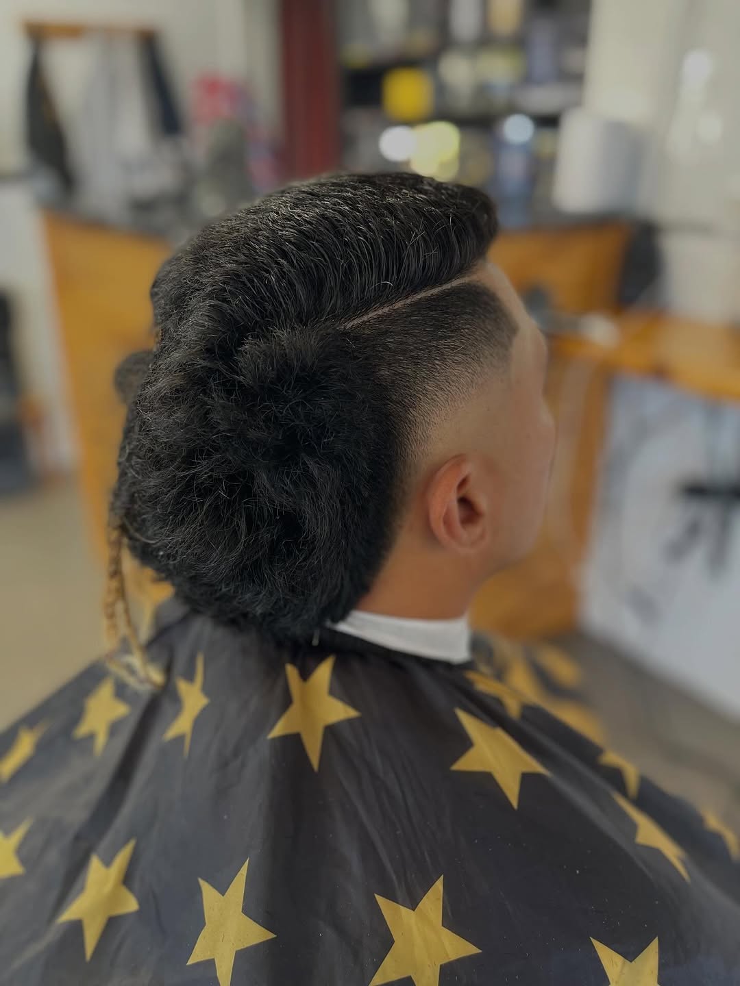 Burst fade with textured top at Kings Barbershop
